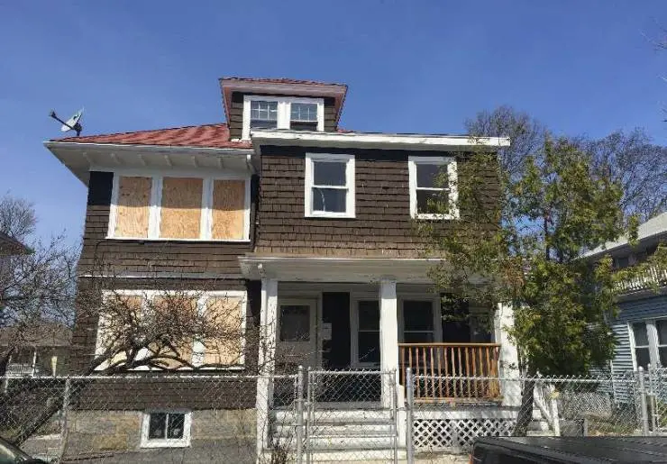 HHB after Renovation Image of boarded up brown run down house before renovation